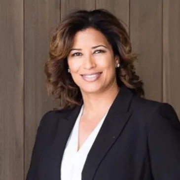 A woman in black jacket and white shirt.