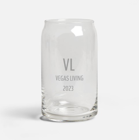 A glass with the words " vegas living 2 0 2 1 ".