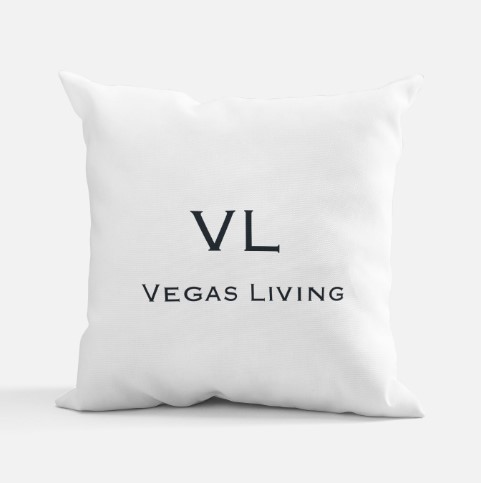 A pillow with the letters vl and vegas living on it.